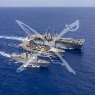 USS Wasp (LHD-1) conducts a replenishment at sea with the USNS John Lenthall (T-AO-189) and USS Porter (DDG-78).